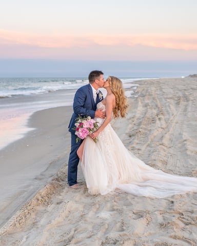 Couple on Corolla beach at sunset