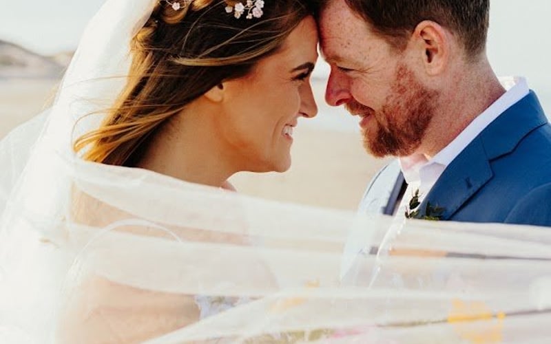Bride and groom, foreheads together
